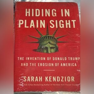 Hiding in Plain Sight Coffee Table Book by Sarah Kendzior - Red Cover